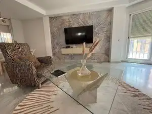 Sala d'estar de Casa o xalet en venda en Gines amb Jardí privat i Moblat