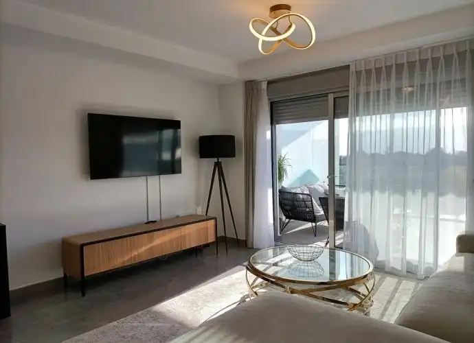 Living room of Flat for sale in Estepona  with Air Conditioner, Terrace and Storage room