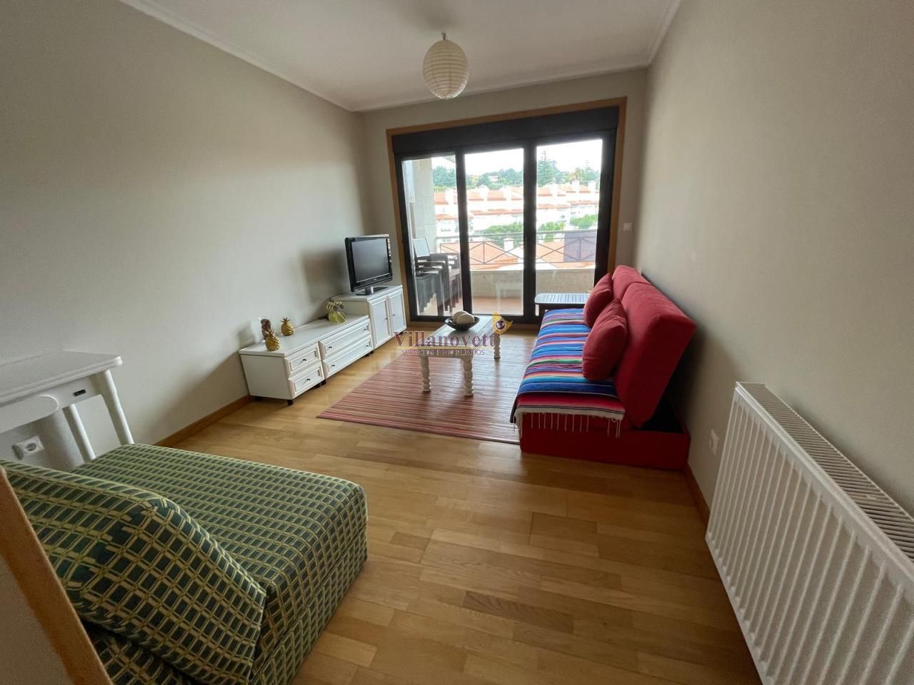 Sala d'estar de Apartament en venda en Sanxenxo amb Calefacció, Terrassa i Traster