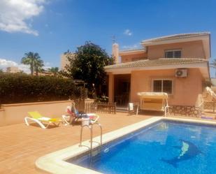 Vista exterior de Casa o xalet en venda en La Manga del Mar Menor amb Aire condicionat, Calefacció i Jardí privat