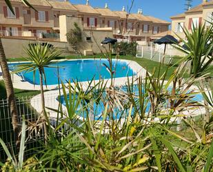 Swimming pool of Single-family semi-detached for sale in Isla Cristina  with Air Conditioner, Terrace and Storage room