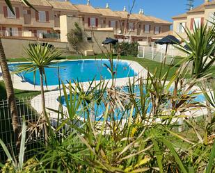 Swimming pool of Single-family semi-detached for sale in Isla Cristina  with Air Conditioner, Terrace and Balcony