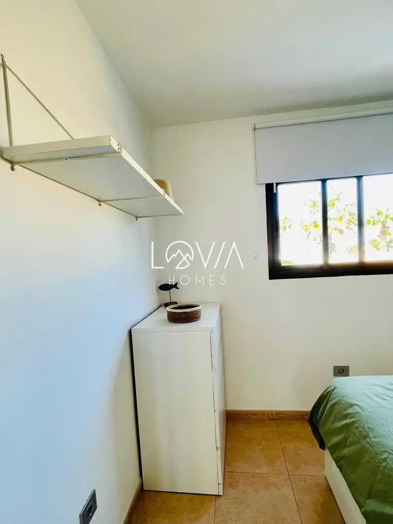 Dormitori de Apartament de lloguer en La Oliva amb Terrassa, Piscina i Piscina comunitària
