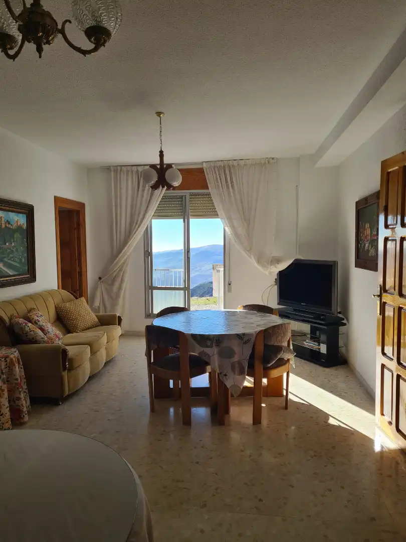Sala de estar de Casa adosada en venta en Alpujarra de la Sierra con Aire acondicionado, Calefacción y Terraza