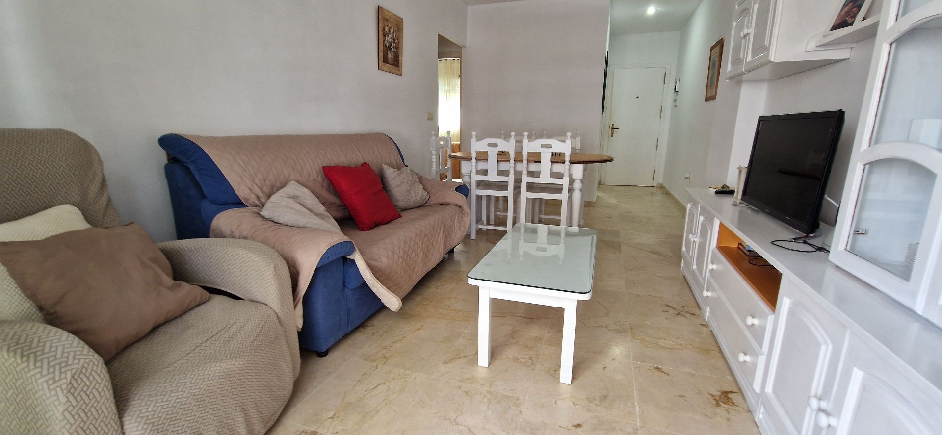 Sala d'estar de Apartament de lloguer en El Portil amb Moblat i Piscina comunitària