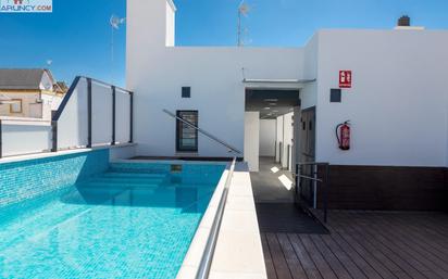 Swimming pool of Duplex for sale in  Sevilla Capital  with Air Conditioner