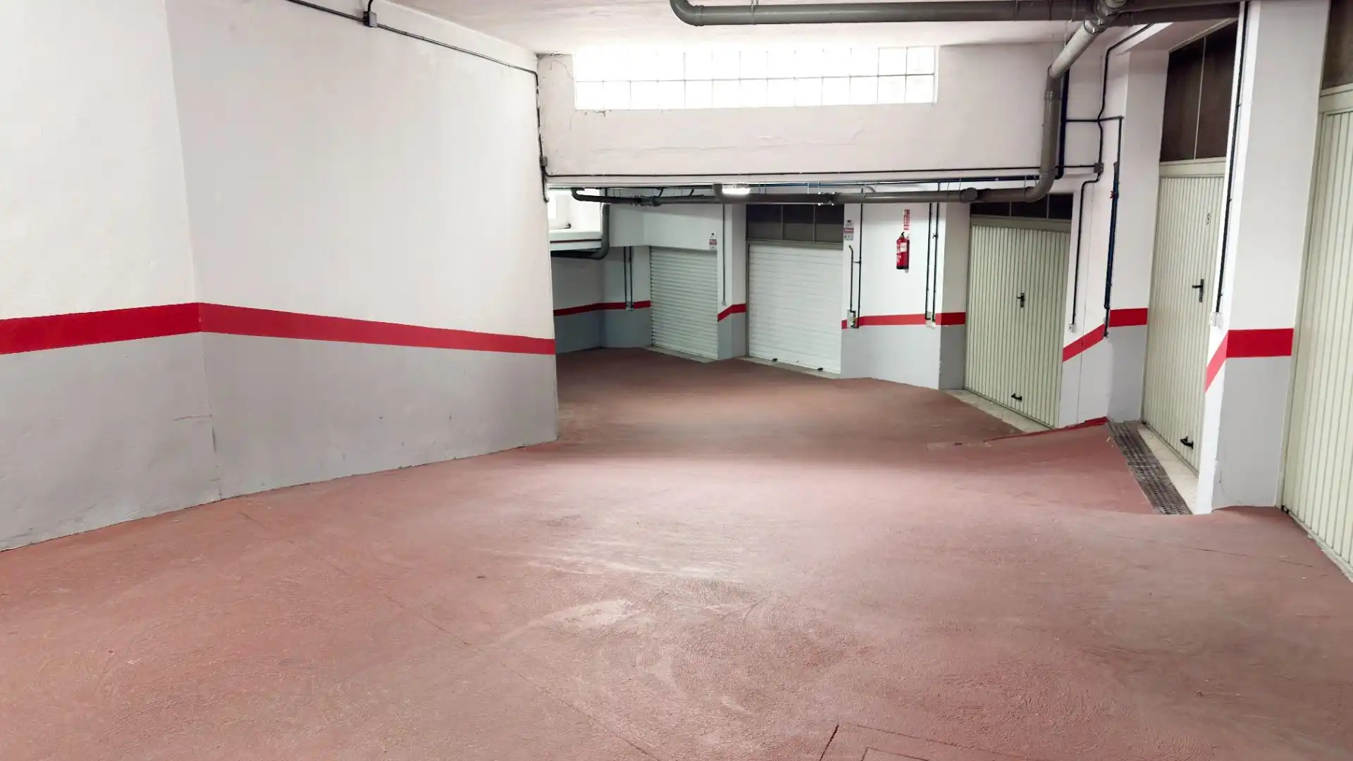Parking de Casa adosada de alquiler en Punta Umbría con Terraza y Piscina comunitaria