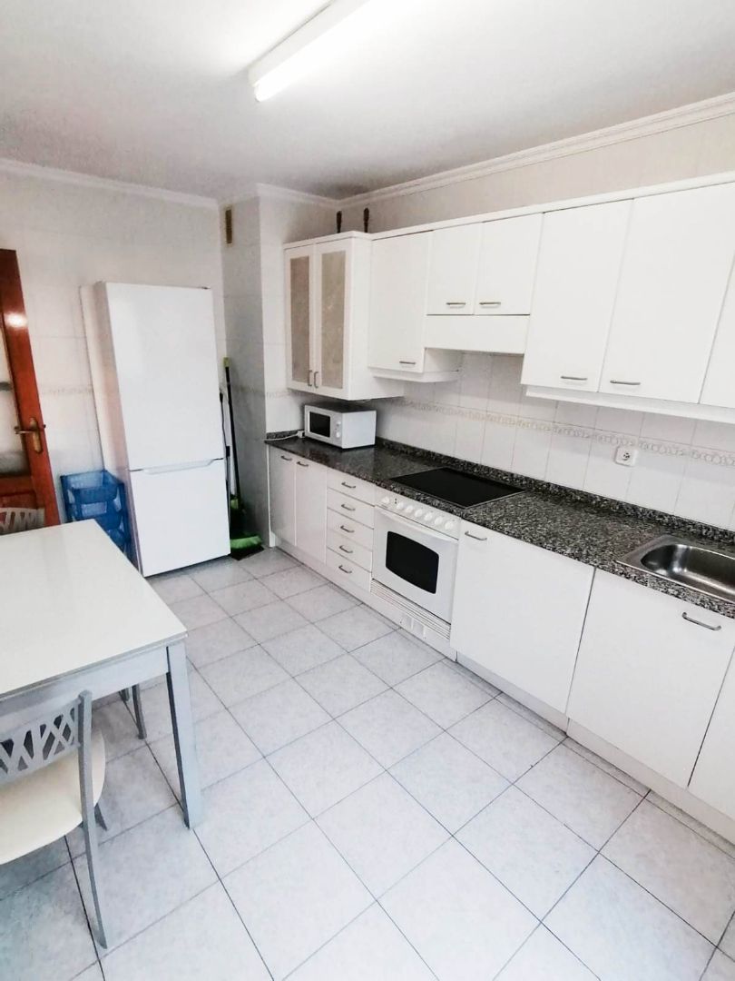 Kitchen of Flat for sale in Gijón   with Heating, Parquet flooring and Storage room