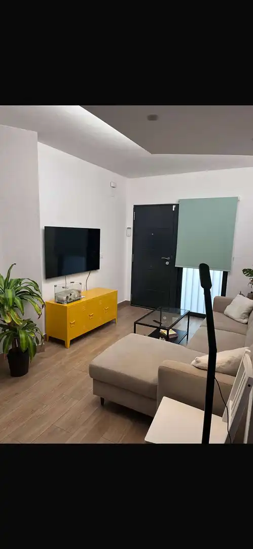 Sala d'estar de Apartament per a compartir en Granada amb Aire condicionat, Terrassa i Moblat