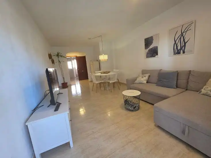 Sala de estar de Apartamento en venta en La Manga del Mar Menor con Amueblado, Balcón y Piscina comunitaria