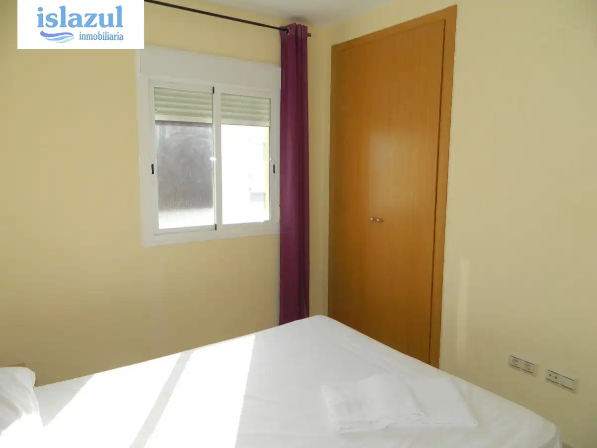 Habitación de Apartamento de alquiler en Isla Cristina con Aire acondicionado, Jardín privado y Terraza