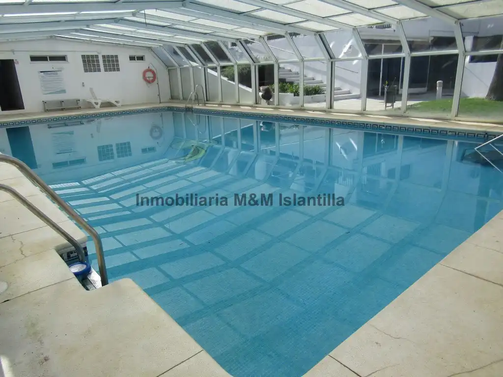 Piscina de Casa adosada en venta en Islantilla con Terraza, Trastero y Amueblado
