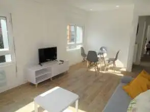 Sala d'estar de Pis de lloguer en Gijón  amb Calefacció, Parquet i Moblat