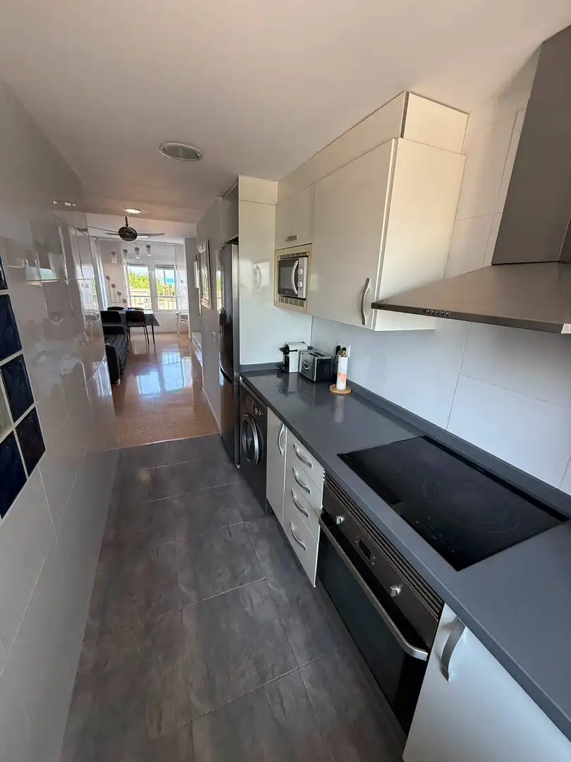 Cuina de Apartament de lloguer en El Puig de Santa Maria amb Aire condicionat, Moblat i Piscina comunitària