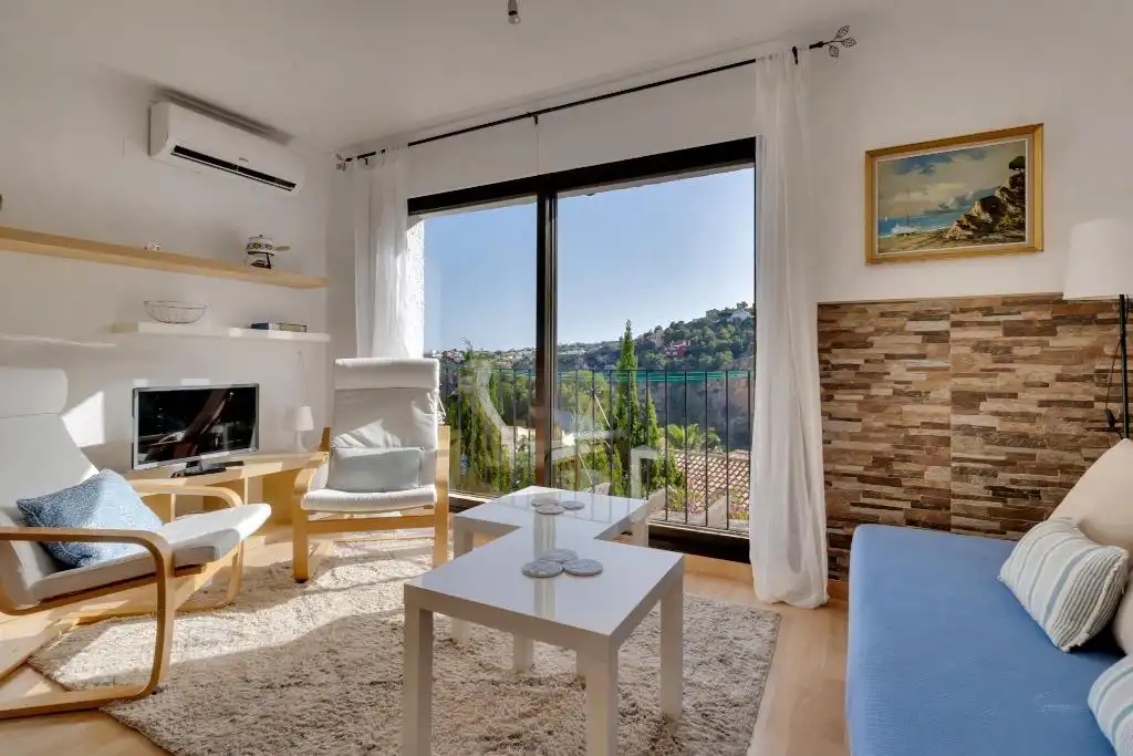 Sala d'estar de Apartament en venda en Benitachell / El Poble Nou de Benitatxell amb Aire condicionat, Terrassa i Piscina