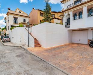 Exterior view of Single-family semi-detached for sale in  Granada Capital  with Air Conditioner, Terrace and Swimming Pool