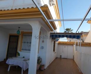 Exterior view of Single-family semi-detached for sale in Pilar de la Horadada  with Private garden, Storage room and Furnished