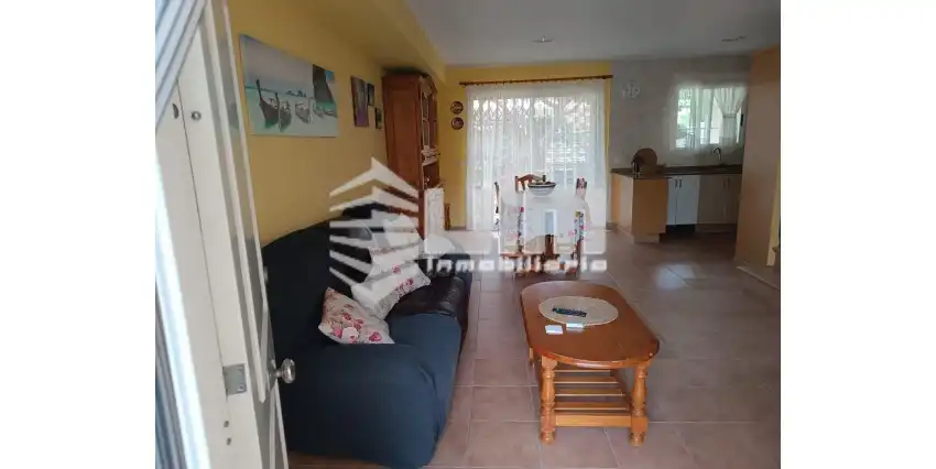 Sala d'estar de Casa adosada en venda en Sagunto / Sagunt amb Terrassa