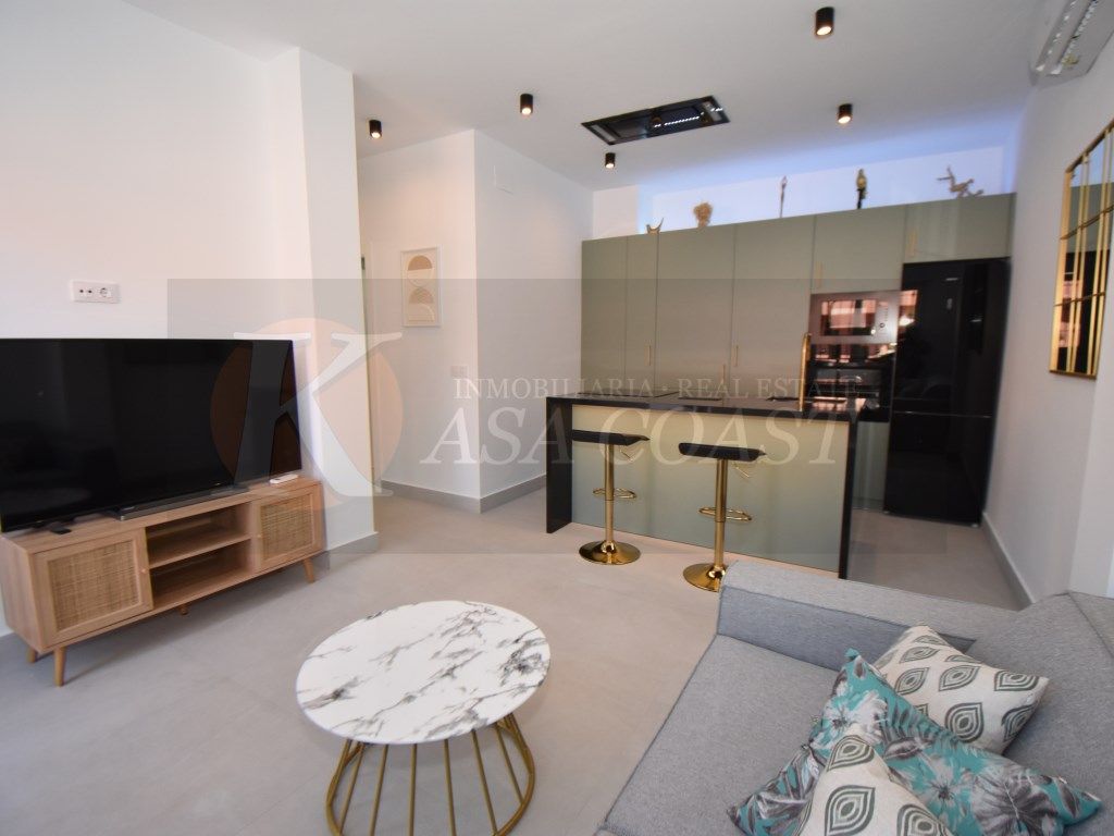 Living room of Flat for sale in Fuengirola  with Air Conditioner, Private garden and Community pool
