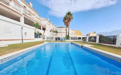 Vista exterior de Casa adosada en venda en Manilva amb Terrassa i Piscina