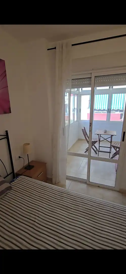 Dormitori de Apartament de lloguer en Adeje amb Piscina comunitària