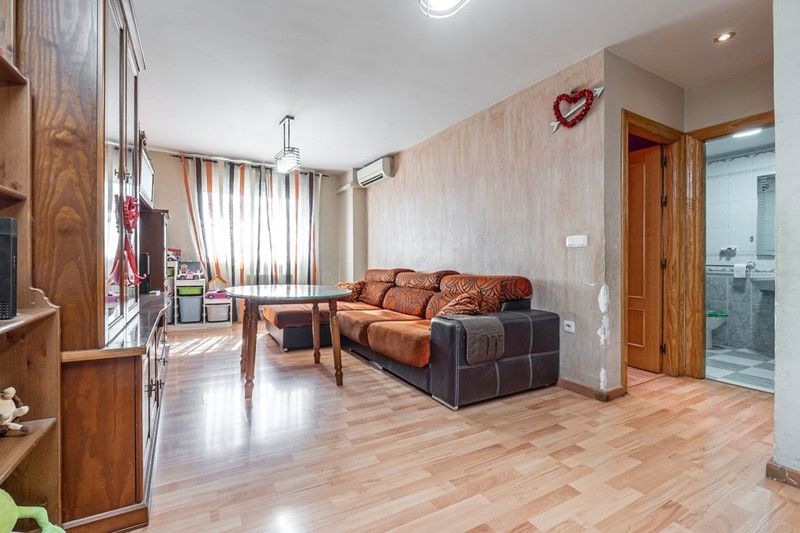 Living room of Planta baja for sale in Churriana de la Vega  with Air Conditioner, Heating and Storage room