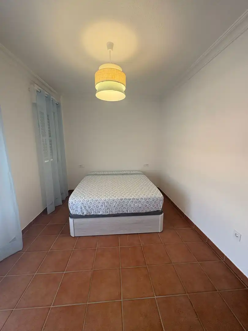 Dormitori de Casa o xalet de lloguer en Aljaraque amb Terrassa i Moblat
