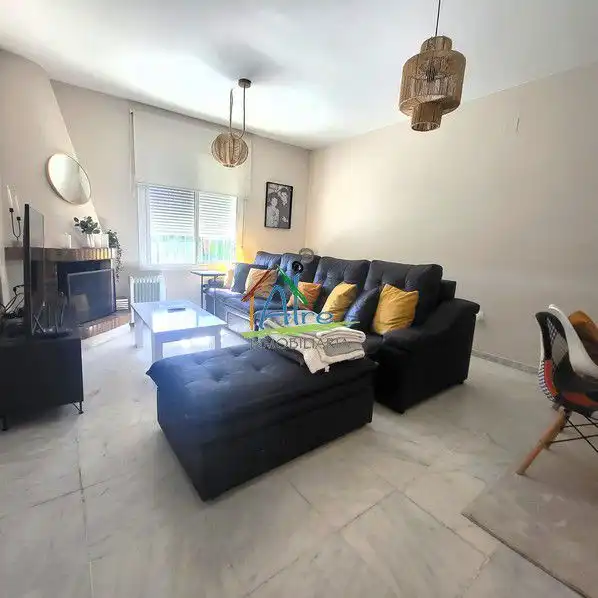 Sala de estar de Casa adosada en venta en Almonte con Aire acondicionado, Calefacción y Jardín privado