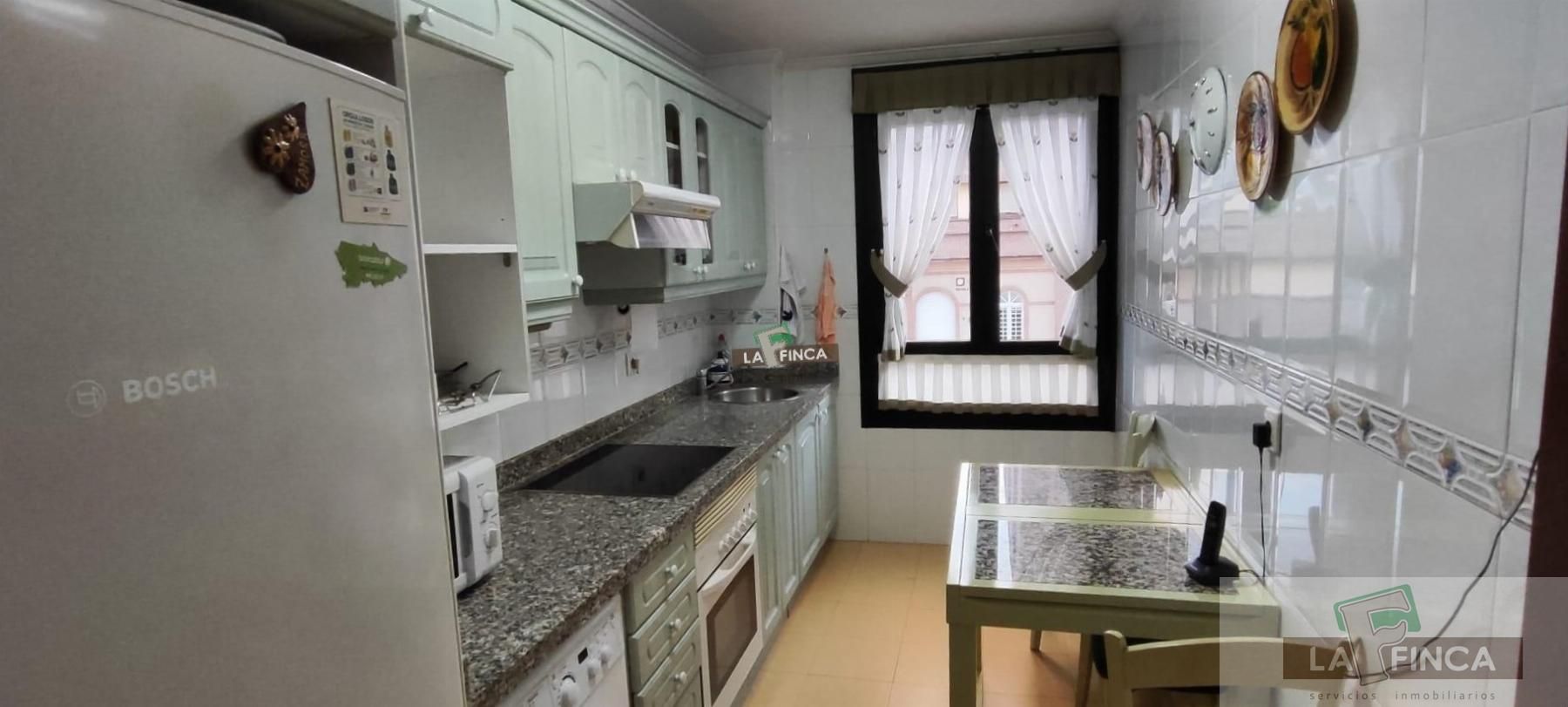 Kitchen of Flat for sale in Oviedo   with Heating, Parquet flooring and Storage room