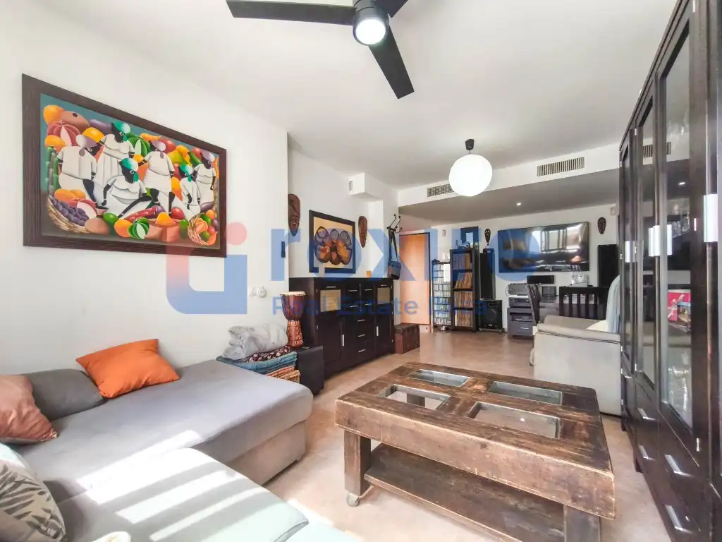 Sala d'estar de Casa adosada en venda en Sant Josep de sa Talaia amb Aire condicionat, Terrassa i Piscina