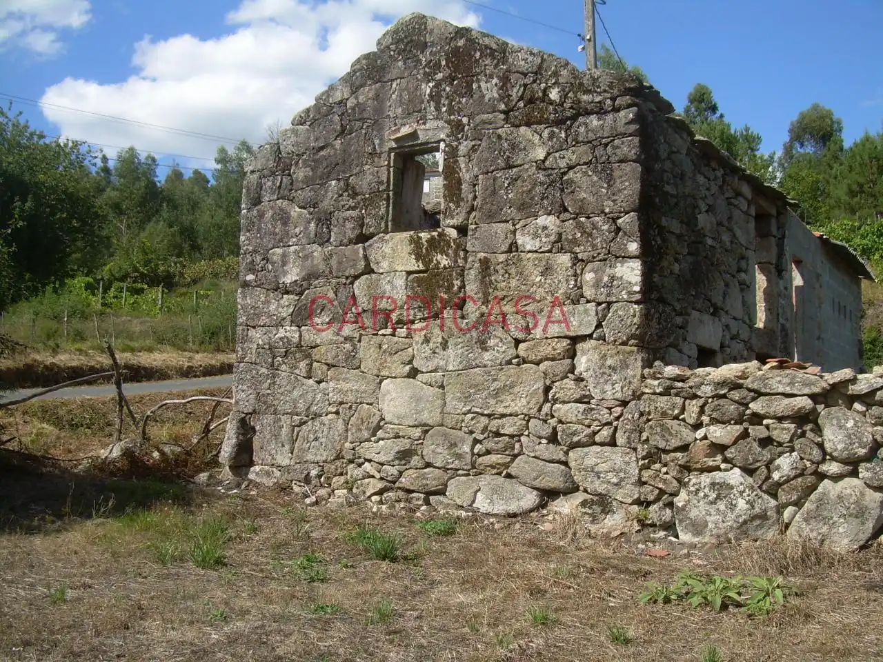 Casa rústica amb jardí en venda a Vilariño