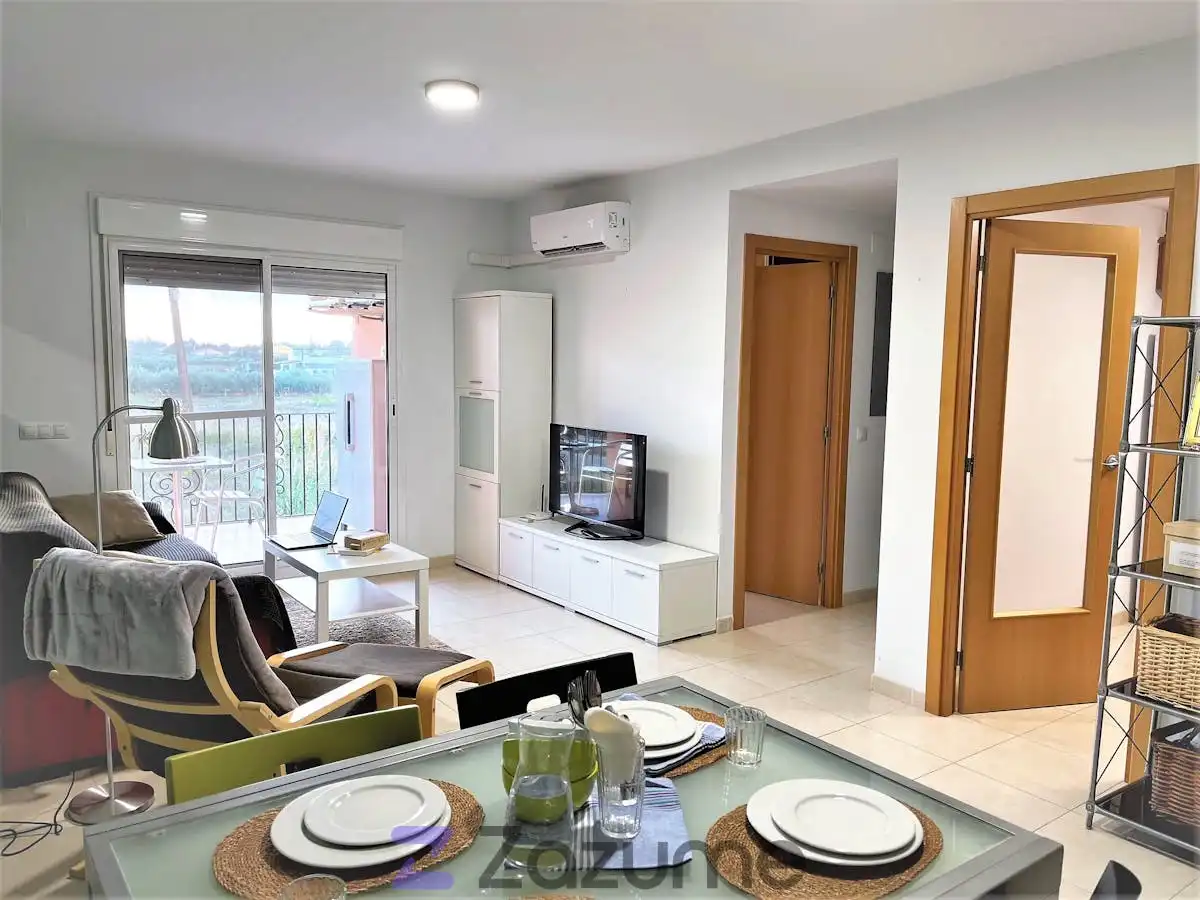 Sala de estar de Piso de alquiler en Camarles con Aire acondicionado, Piscina y Amueblado