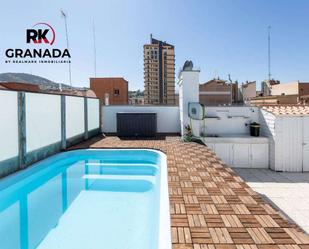 Swimming pool of Attic for sale in  Granada Capital  with Air Conditioner, Terrace and Swimming Pool