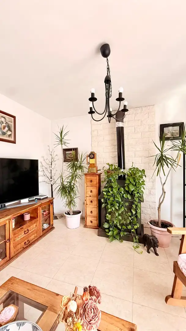 Sala d'estar de Casa adosada en venda en Calafell amb Aire condicionat, Calefacció i Jardí privat
