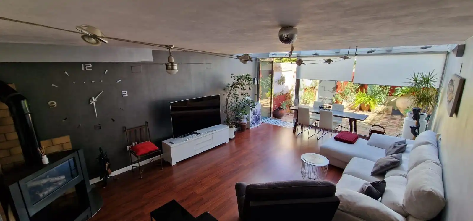 Sala d'estar de Casa adosada de lloguer en Sant Joan d'Alacant amb Aire condicionat, Jardí privat i Terrassa