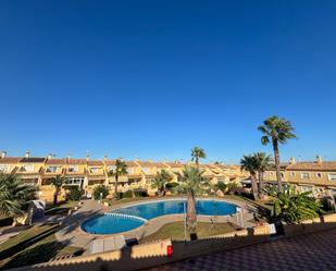 Piscina de Casa adosada de lloguer en Torrevieja amb Aire condicionat i Terrassa