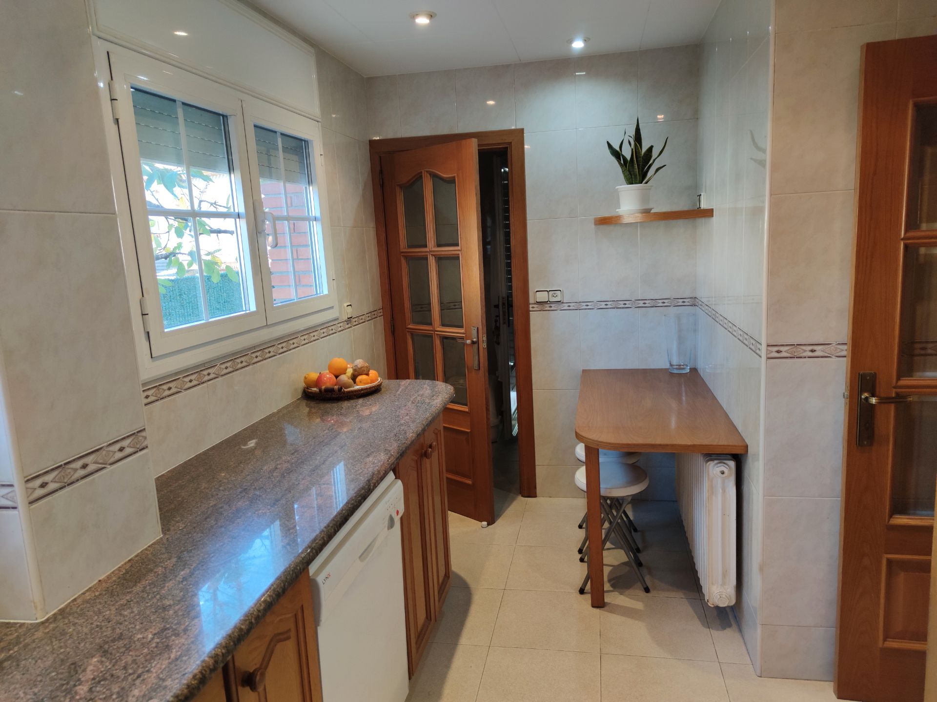 Kitchen of Single-family semi-detached for sale in Sant Joan Les Fonts  with Air Conditioner, Heating and Private garden