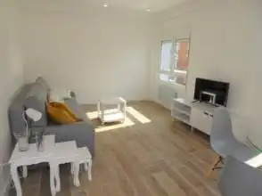 Sala d'estar de Pis de lloguer en Gijón  amb Calefacció, Parquet i Moblat