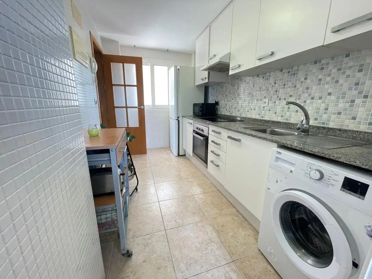 Cuina de Apartament en venda en La Manga del Mar Menor amb Aire condicionat, Terrassa i Piscina