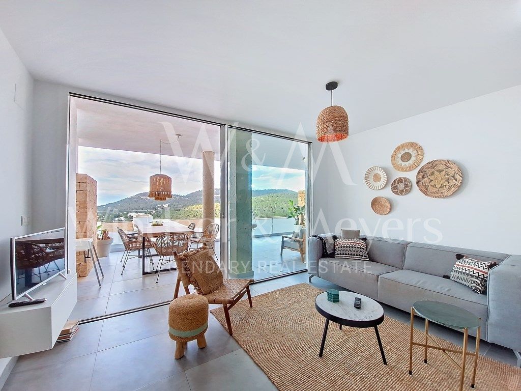 Sala d'estar de Apartament en venda en Sant Josep de sa Talaia amb Aire condicionat, Piscina i Moblat