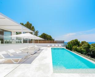 Piscina de Casa o xalet de lloguer en Santa Eulària des Riu amb Aire condicionat, Jardí privat i Terrassa