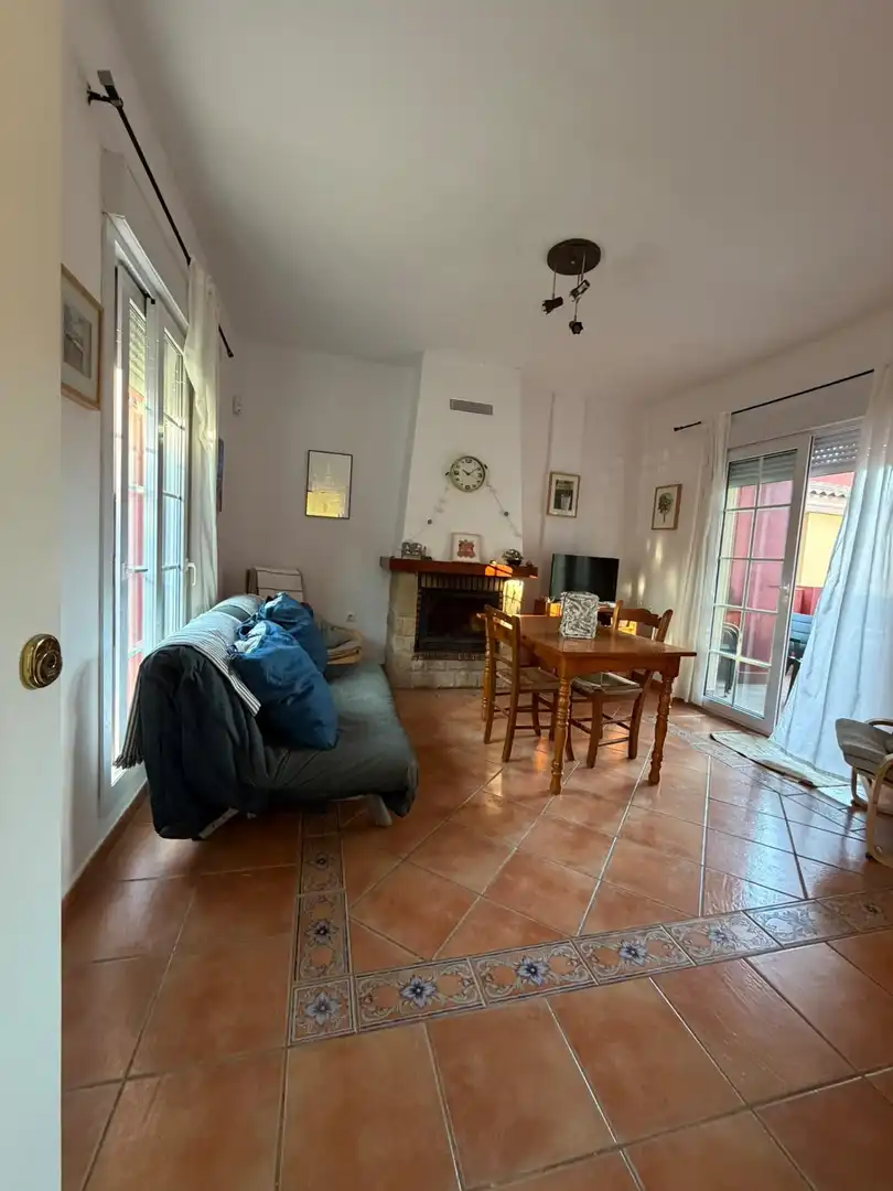 Sala de estar de Casa adosada en venta en Islantilla con Jardín privado, Terraza y Trastero