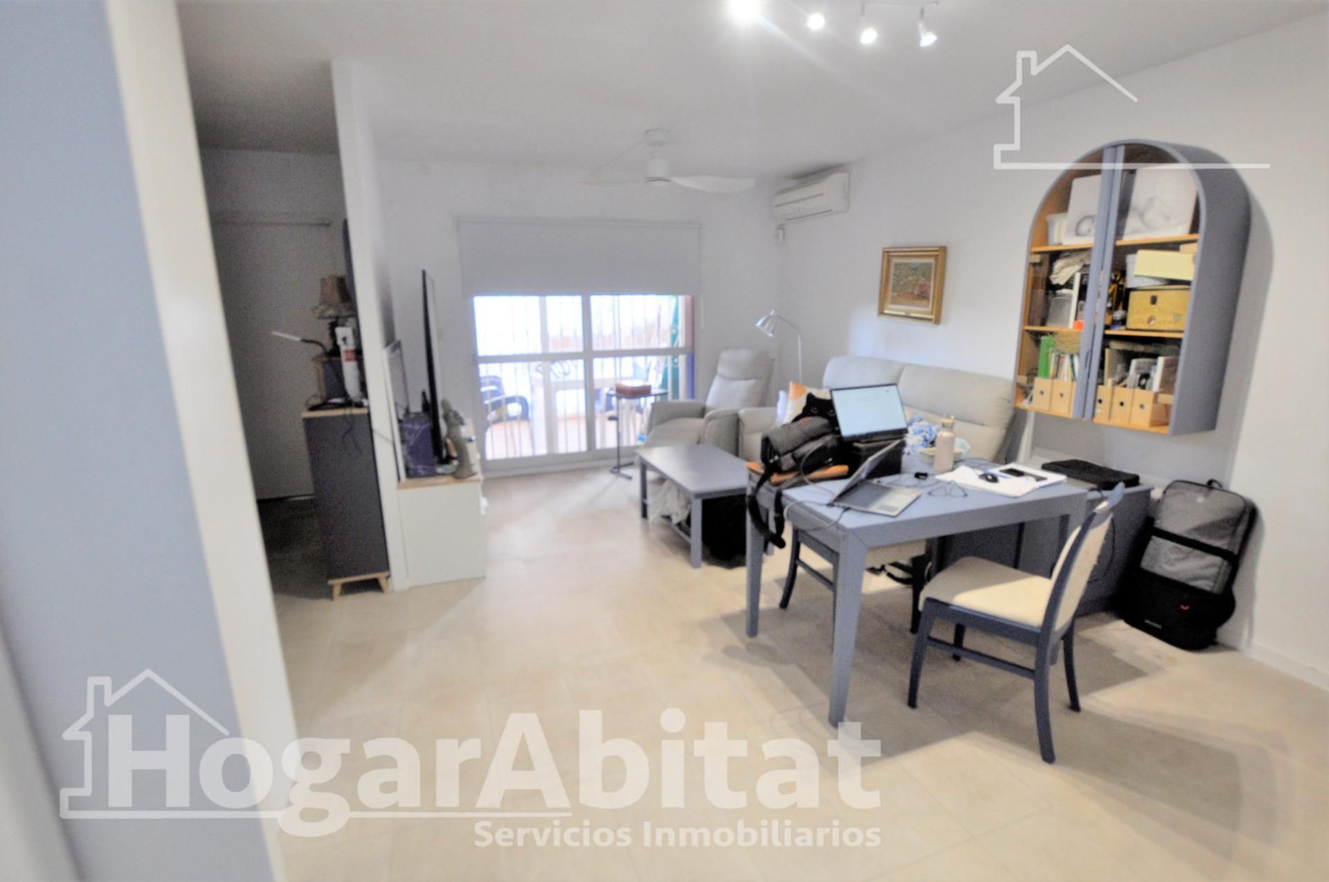 Sala d'estar de Casa adosada en venda en La Pobla de Farnals amb Aire condicionat, Terrassa i Piscina comunitària