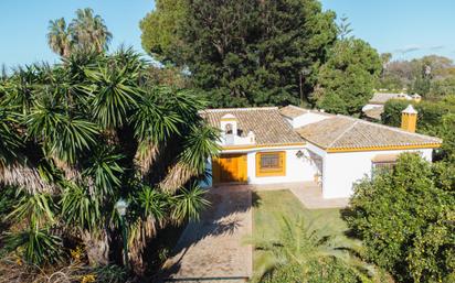 Exterior view of House or chalet for sale in Sanlúcar la Mayor  with Air Conditioner, Heating and Private garden