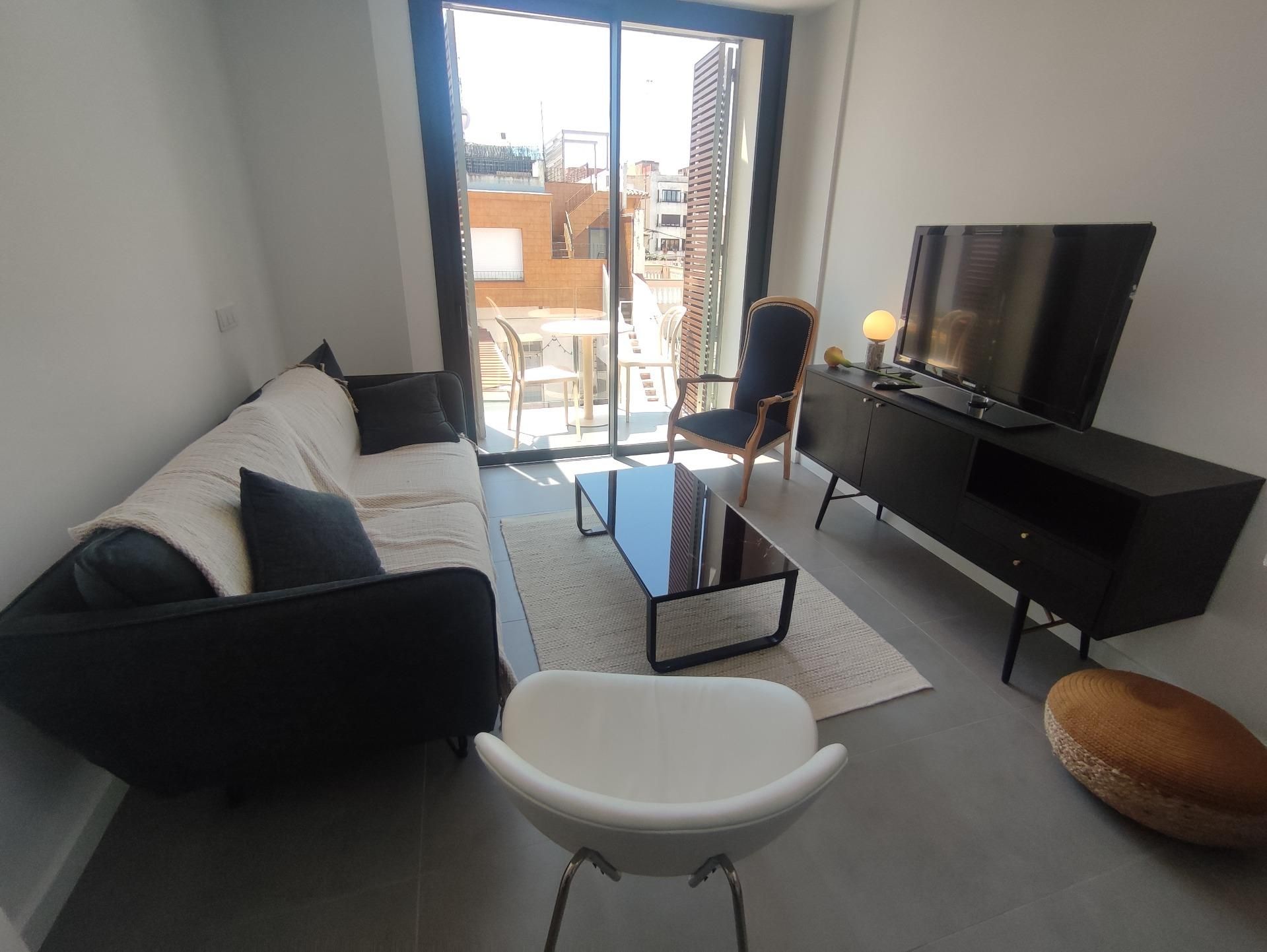 Sala d'estar de Dúplex de lloguer en Palamós amb Aire condicionat, Calefacció i Terrassa