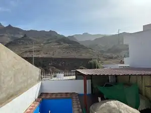 Vista exterior de Casa adosada en venda en Mogán amb Jardí privat, Piscina i Moblat