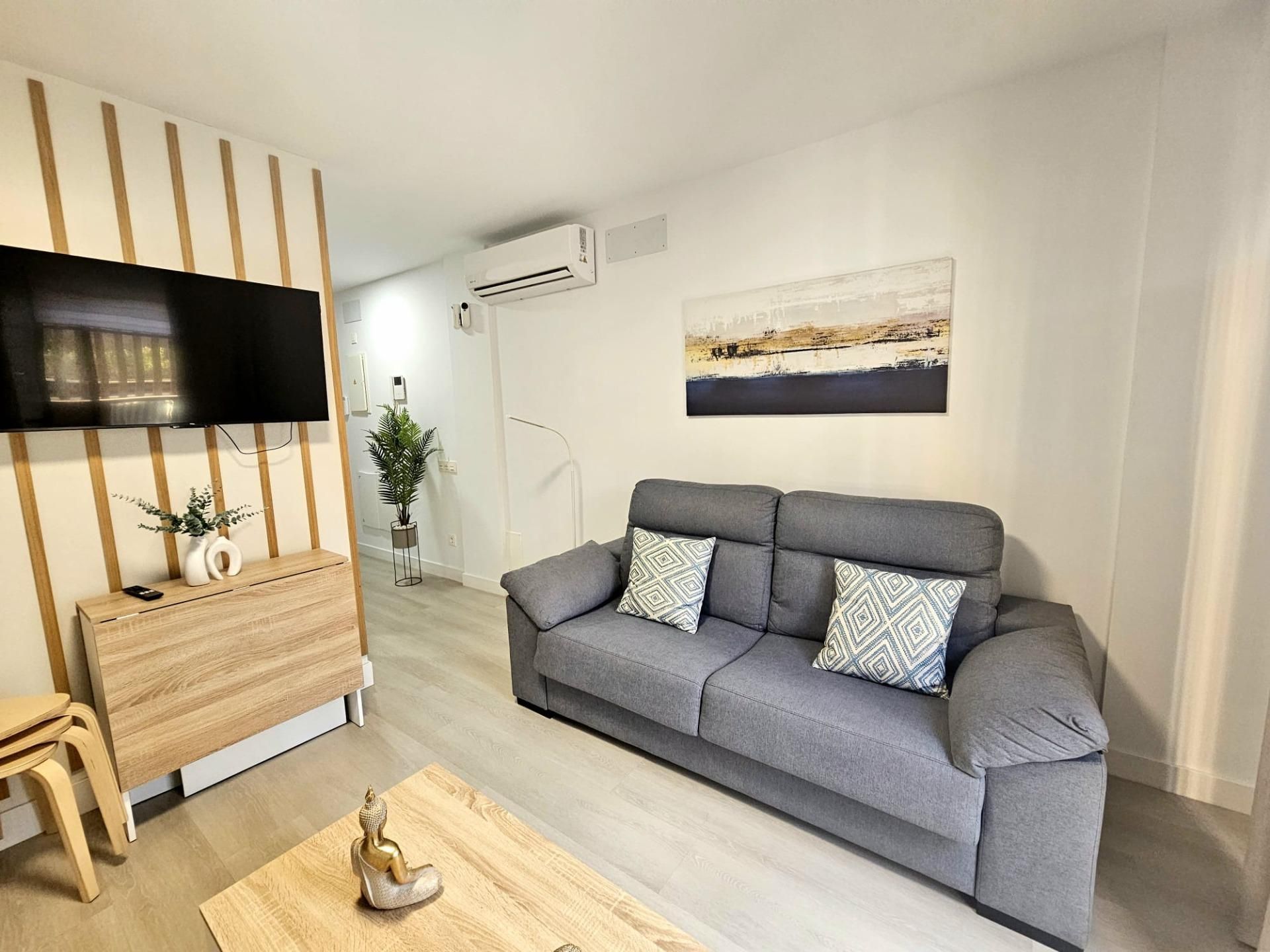 Sala d'estar de Estudi de lloguer en Mogán amb Aire condicionat, Parquet i Terrassa