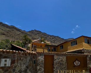 Vista exterior de Casa adosada en venda en Mogán amb Aire condicionat, Terrassa i Piscina