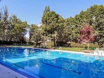 Swimming pool of Flat for sale in  Madrid Capital  with Air Conditioner, Heating and Private garden