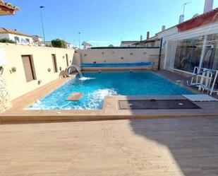 Swimming pool of Single-family semi-detached for sale in Pilar de la Horadada  with Air Conditioner, Private garden and Terrace